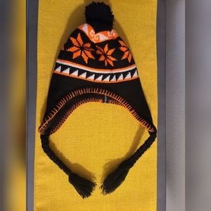 Young Boy's winter hat. Black and orange. Fleece inner lining. Acrylic outer.